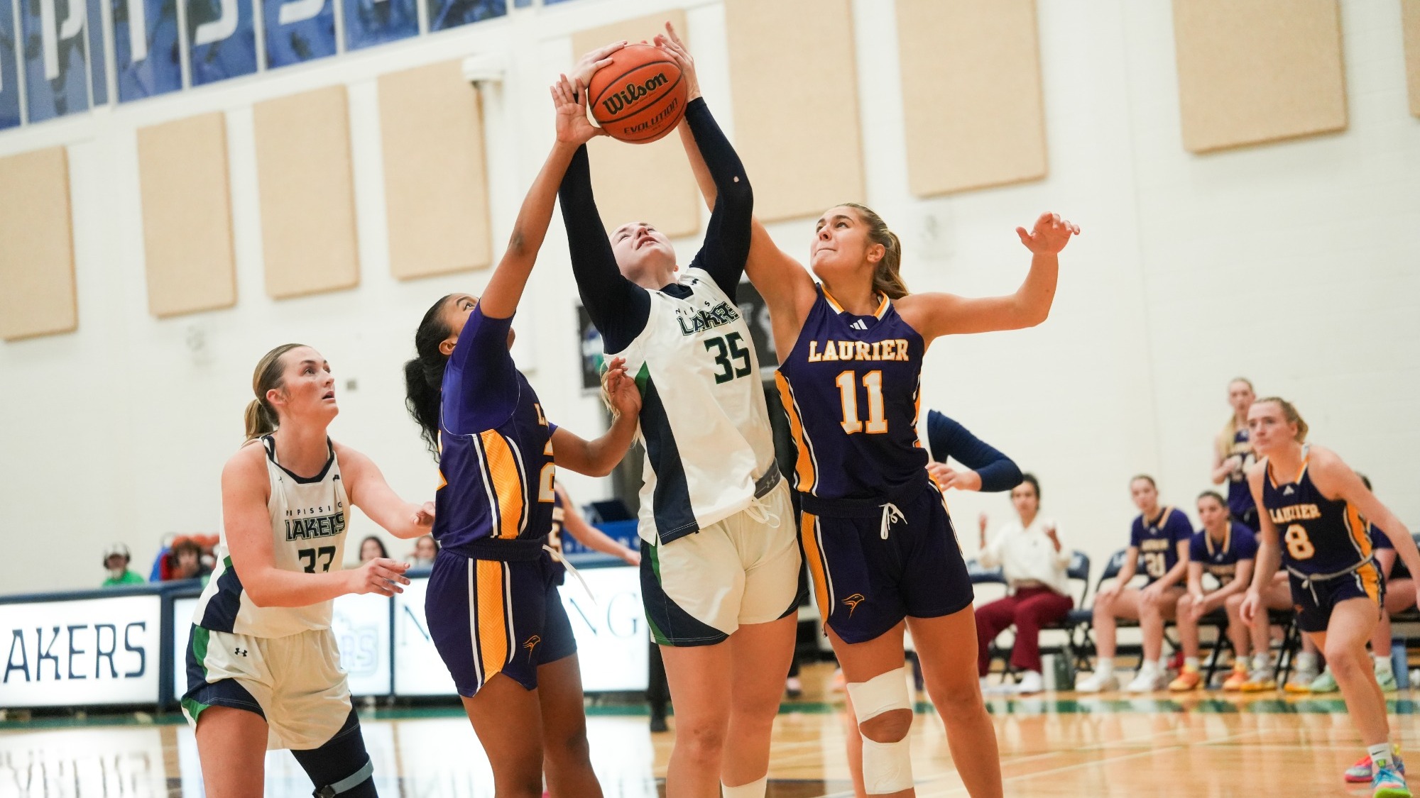 Laurier women's basketball blocks a shot from Nippissing 