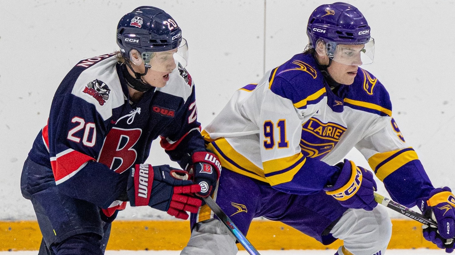 Verbeek reaches for the puck against Brock.