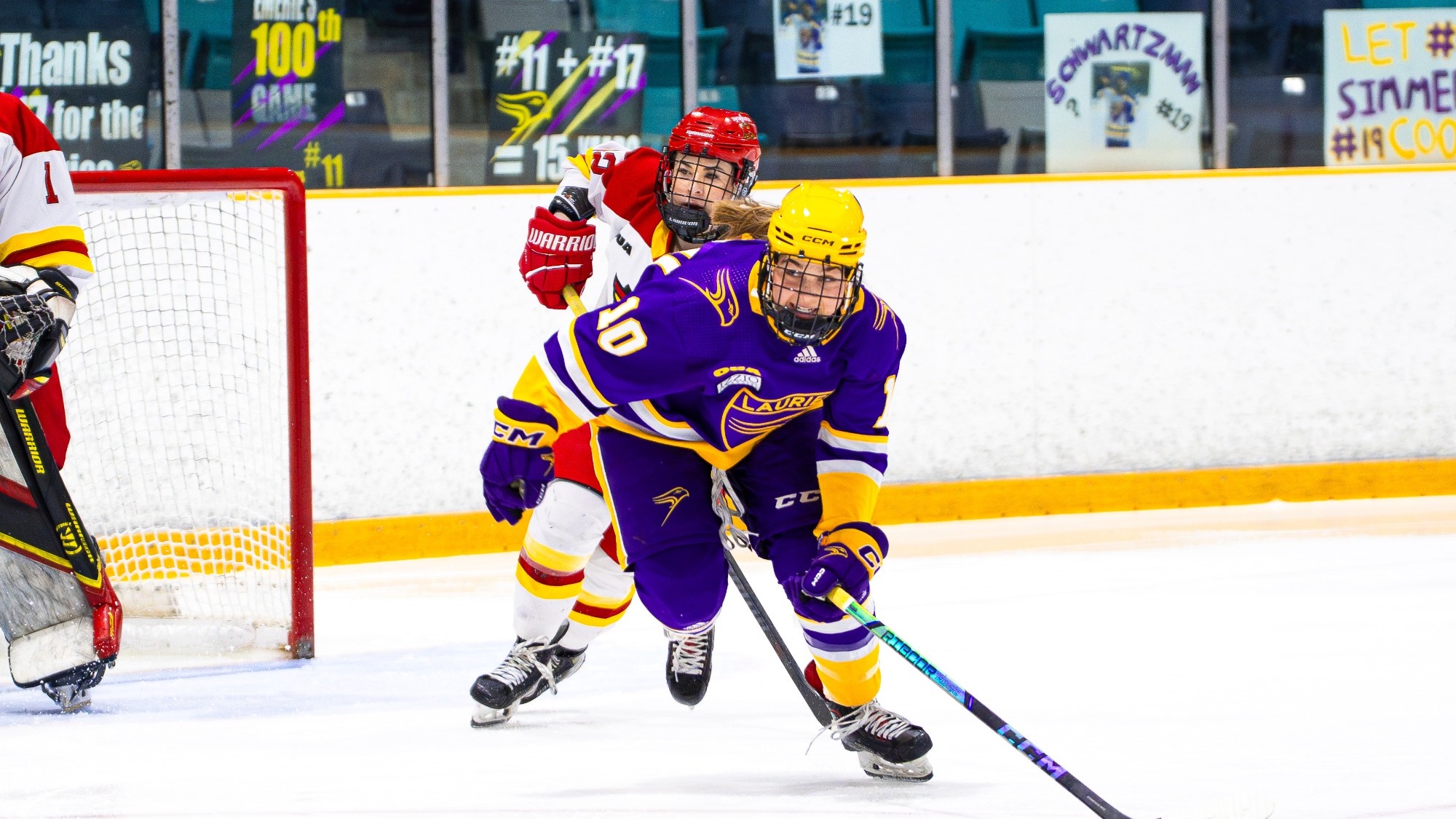 Laurier chases down a Guelph player in the offensive zone.