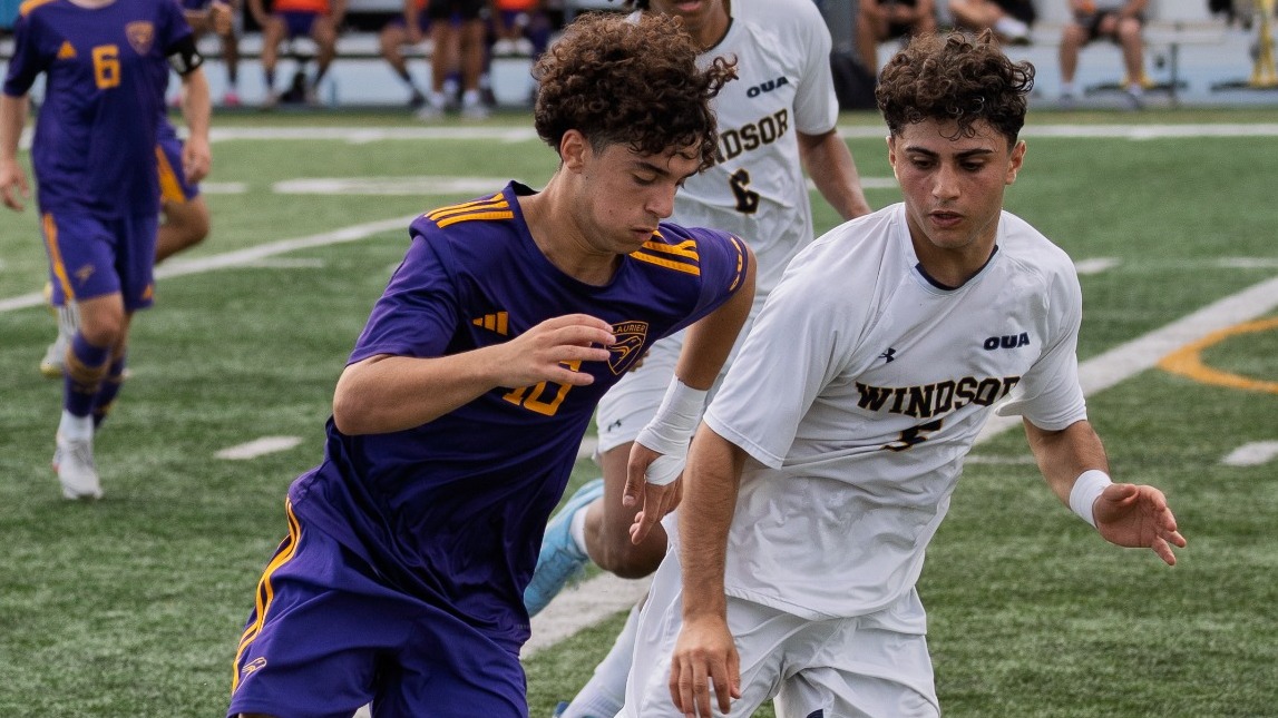 Laurier and Windsor race to the ball.