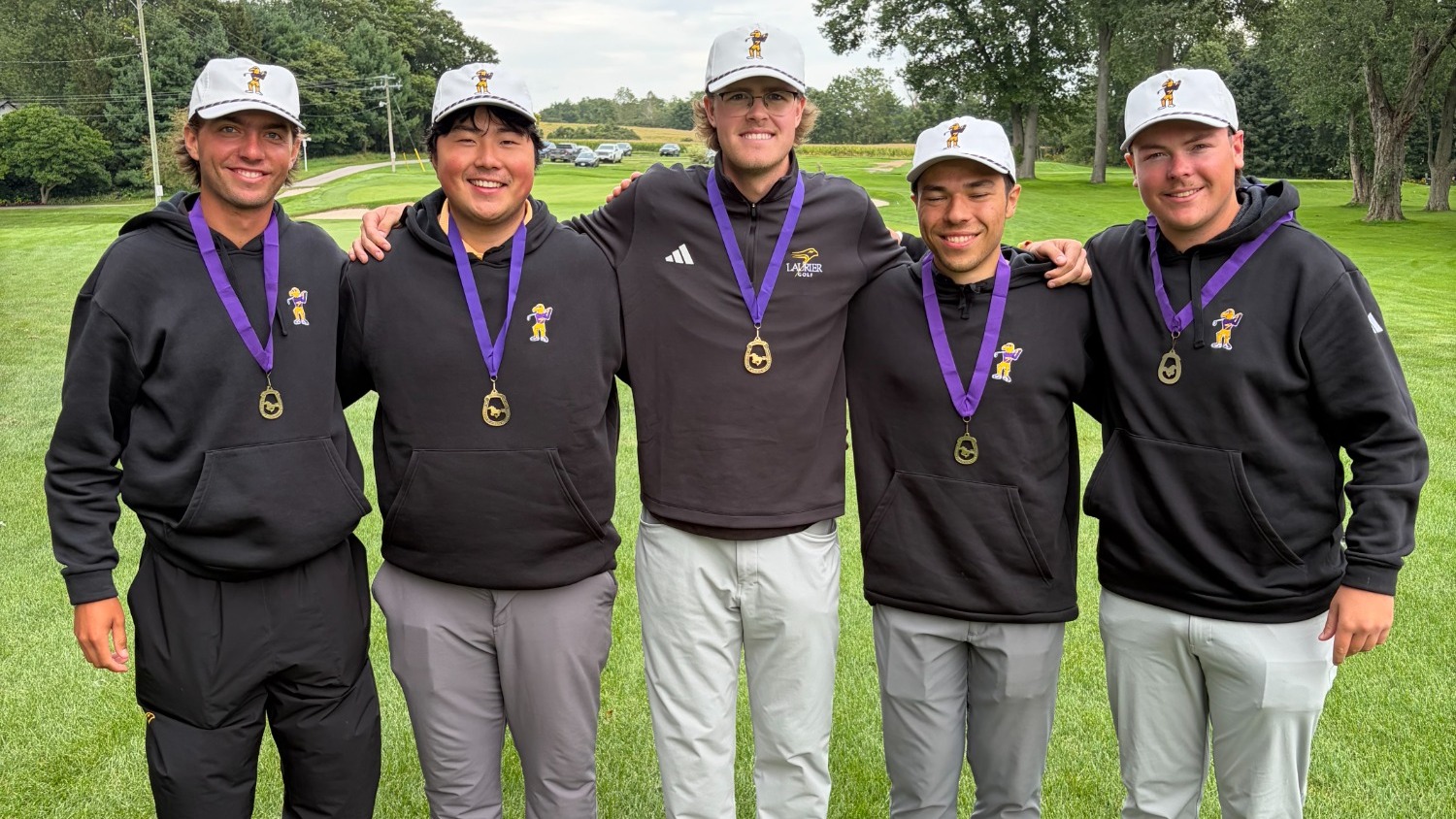Laurier men's golf pose with gold medal from Western Men's Invitational