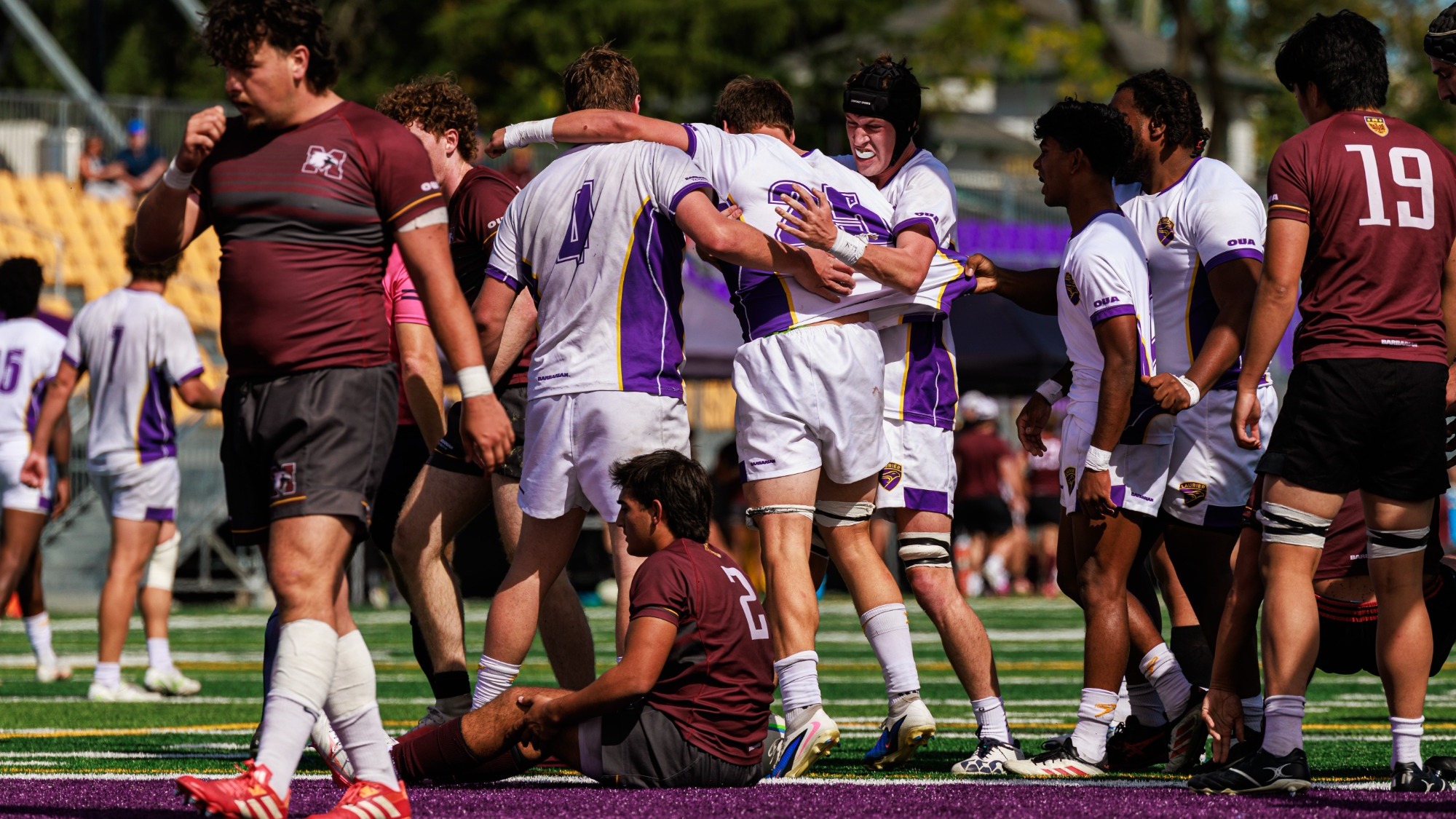 Laurier celebrates a try against McMaster.