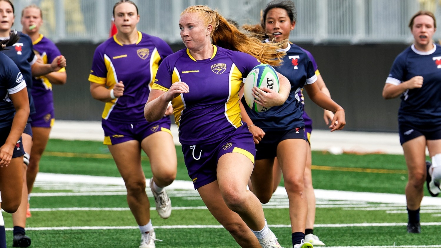 Cait Croft runs in for a try against Toronto