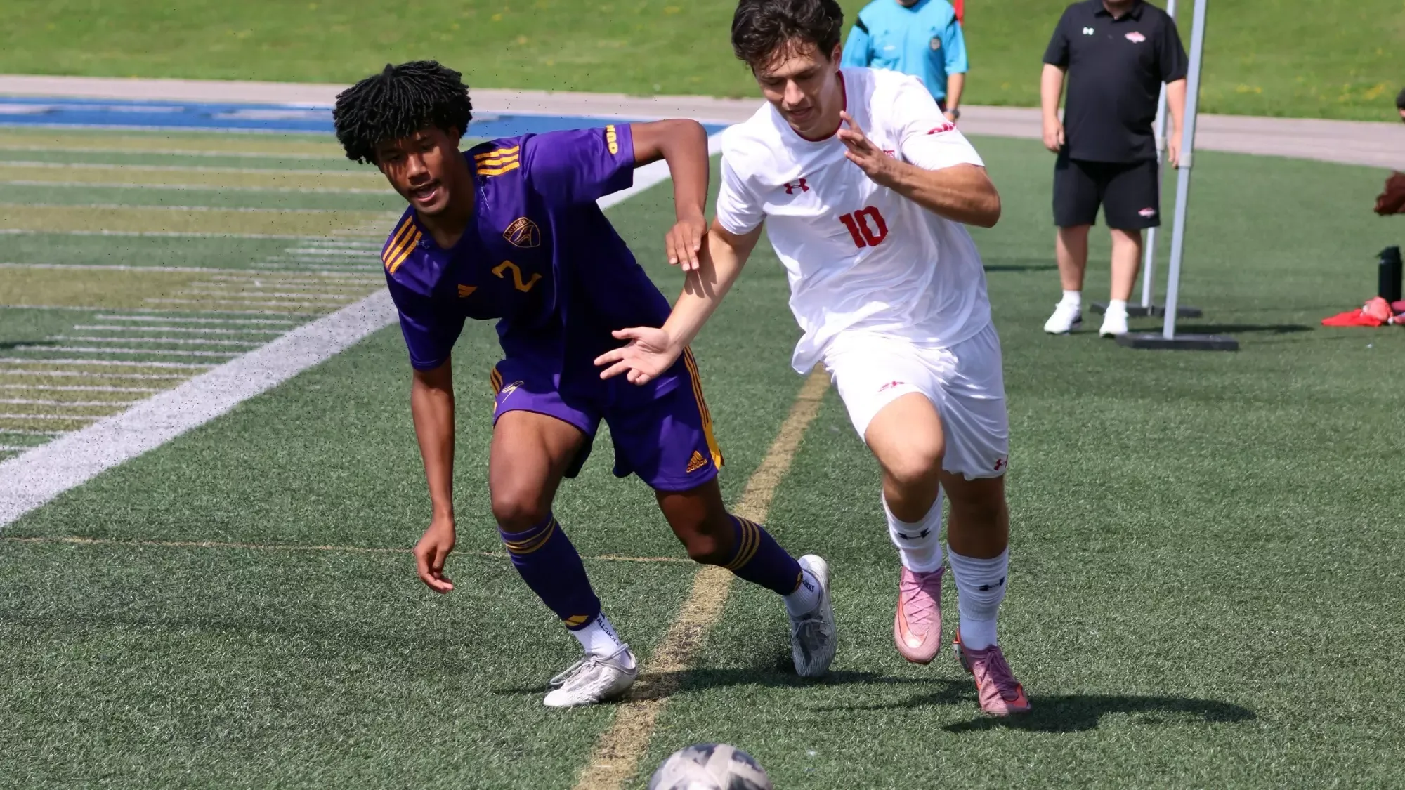 Laurier chases down a loose ball against Algoma.