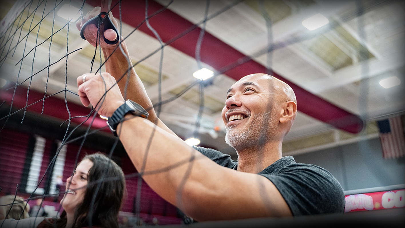 Mario Andaya Cutting Down the Net after winning the GNAC Title 11.23.2024