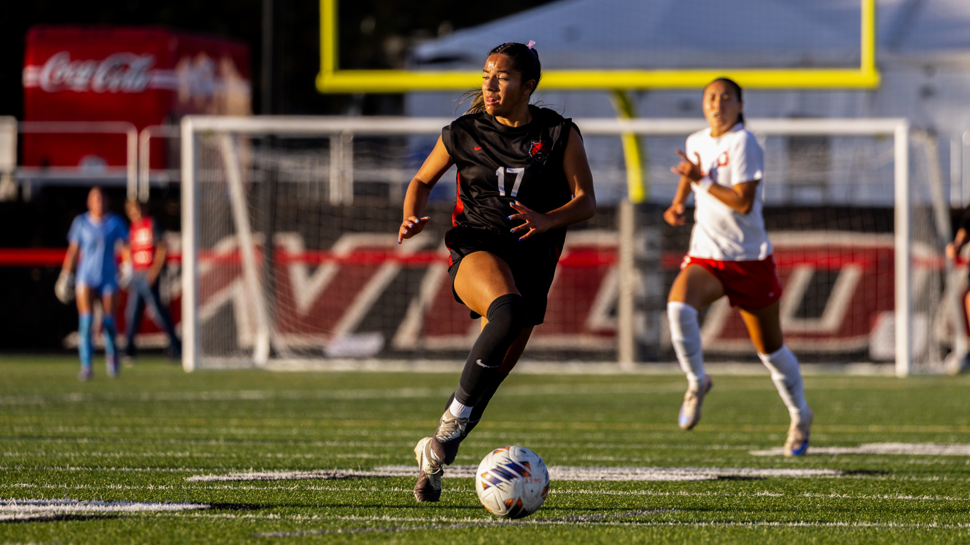 Marisa Badillo dribbling the ball vs SFU.