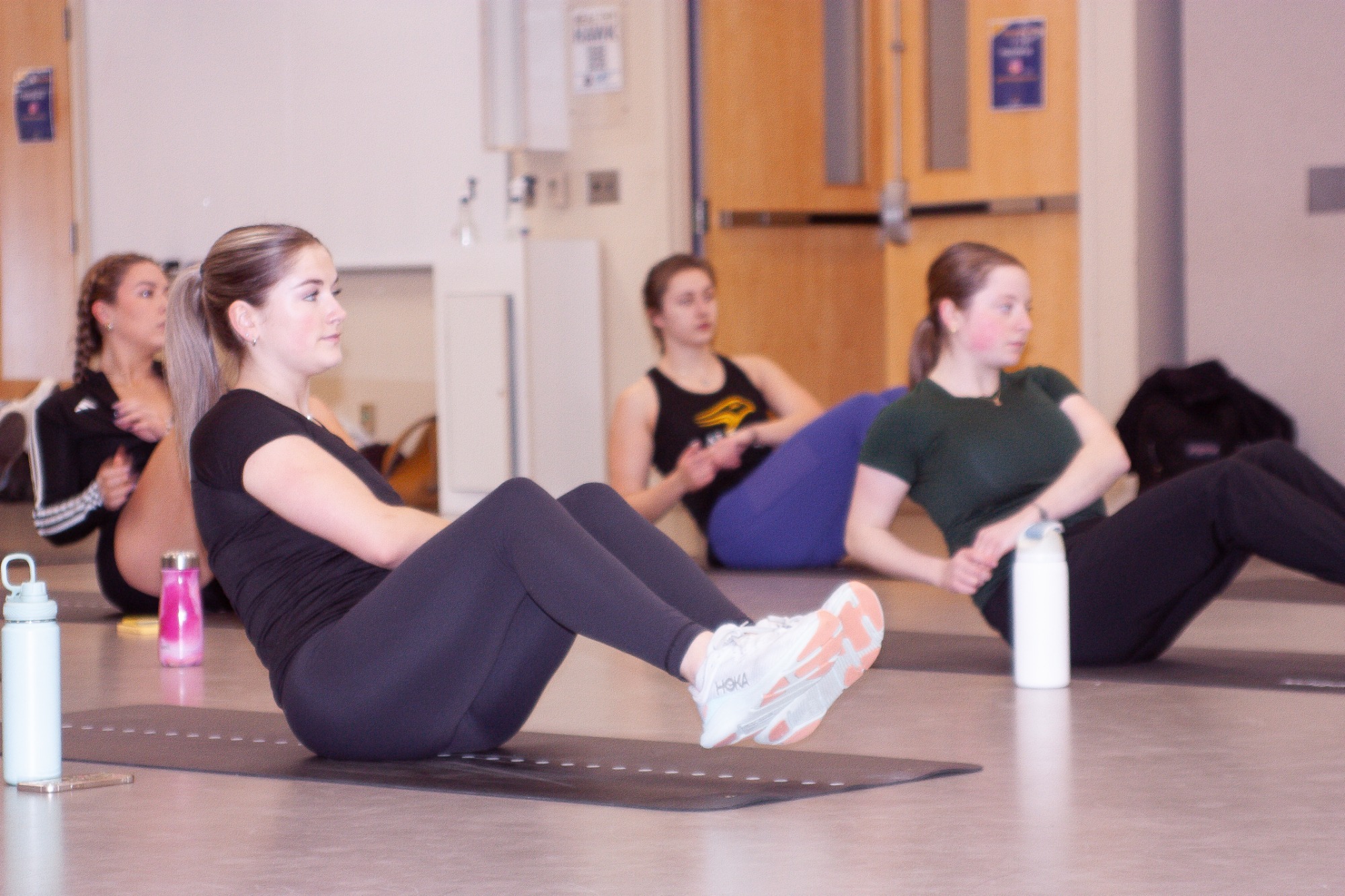 Women participate in a group fitness class