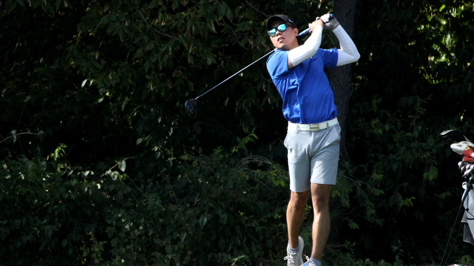 Junchen Huang hits the opening shot.