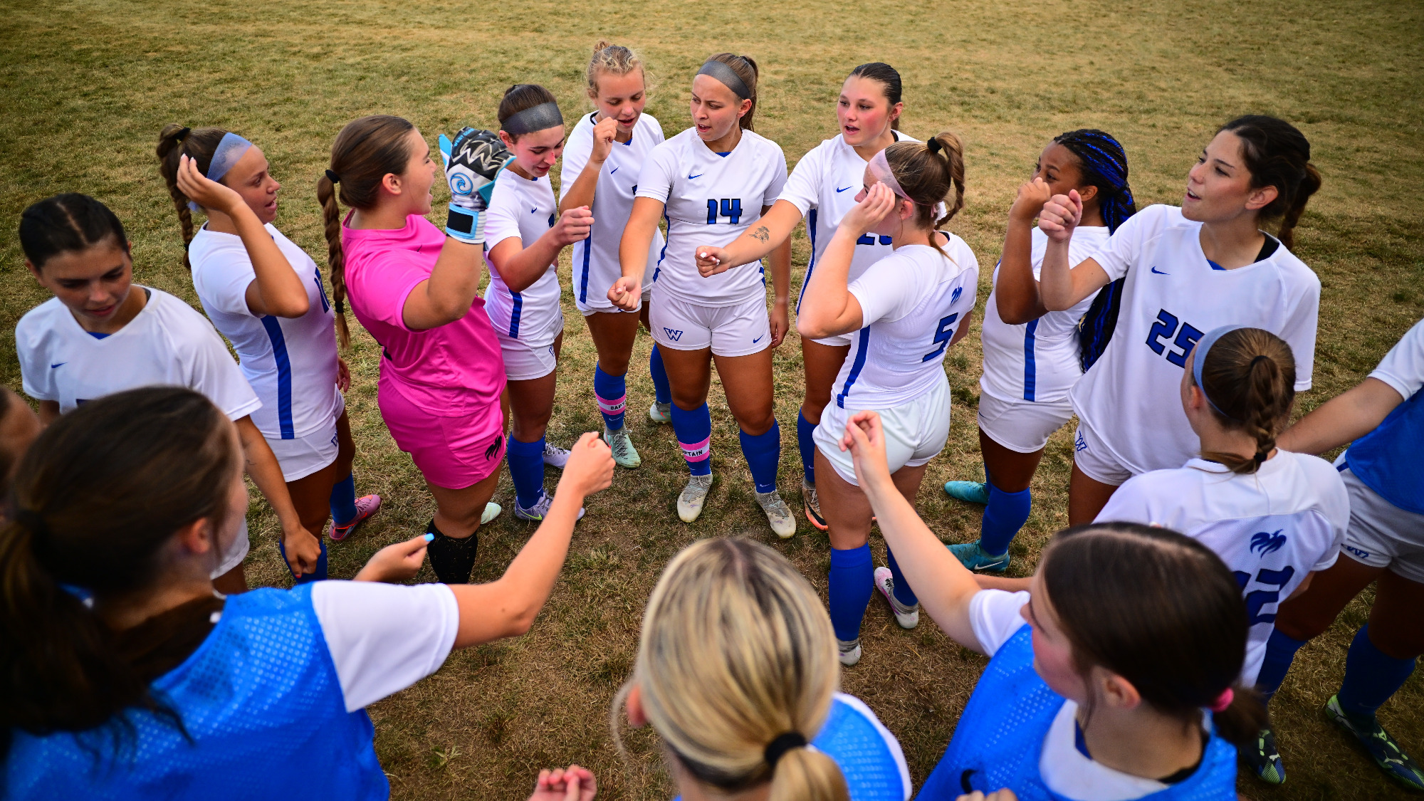 The team huddles before the start of a game.