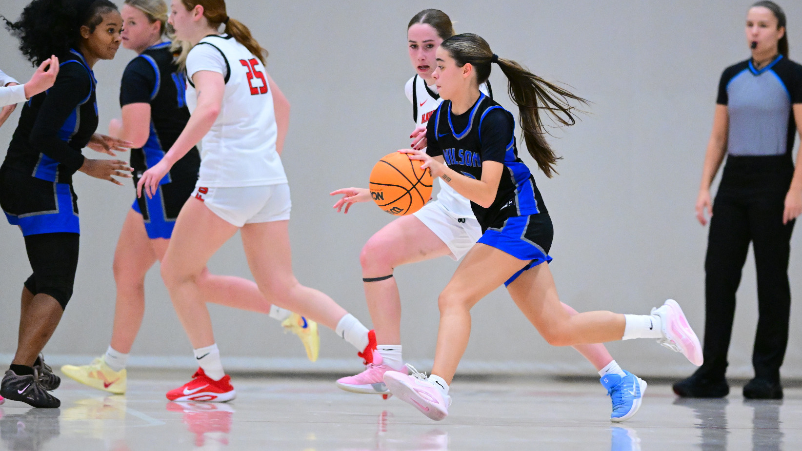 Jewels Torres dribbles by a defender