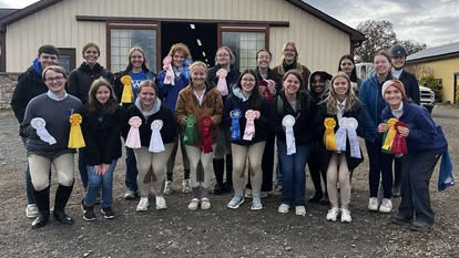 Hunt Seat shows off their ribbons after a show