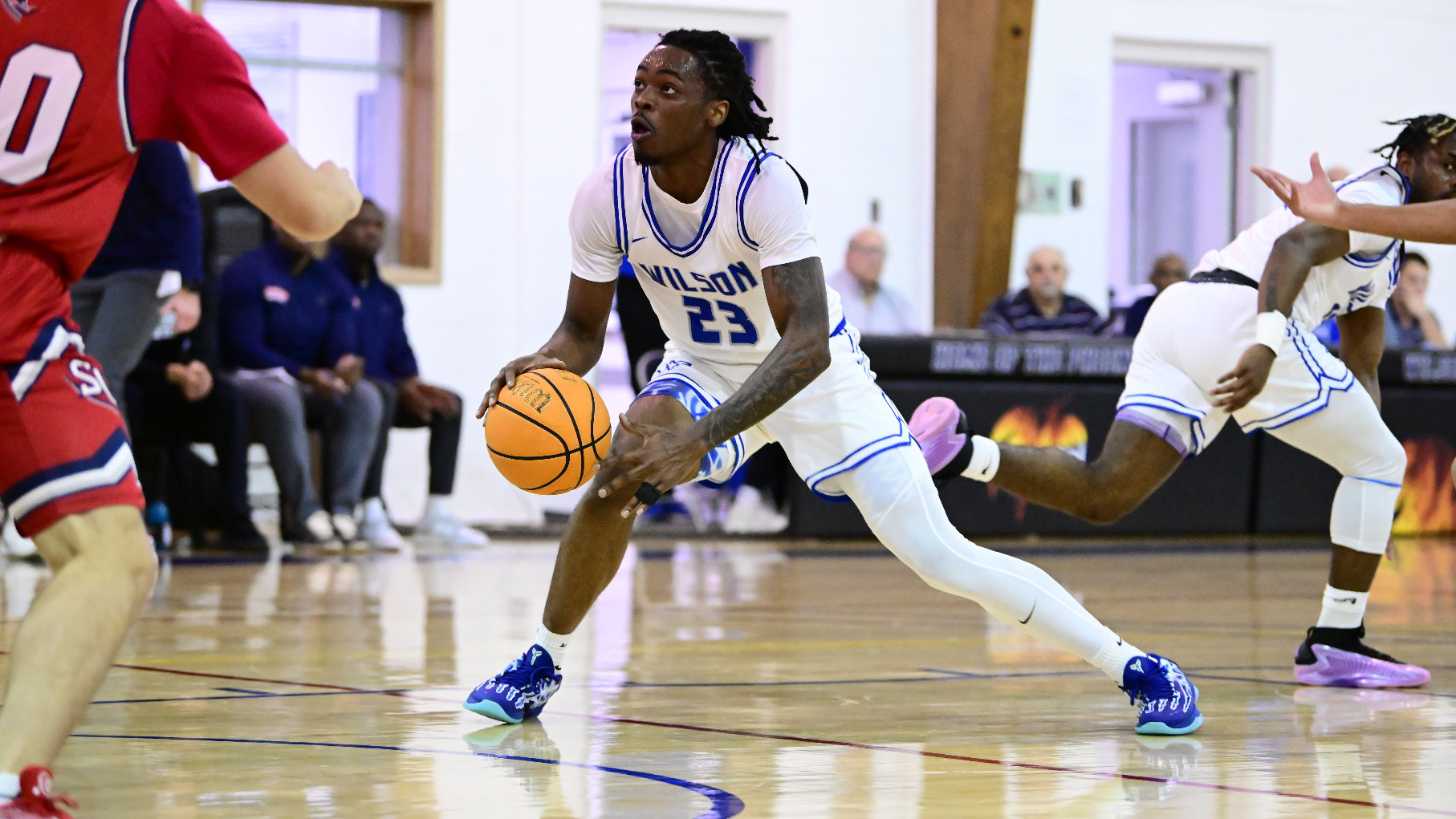 Armani Jones drives the lane for a shot.