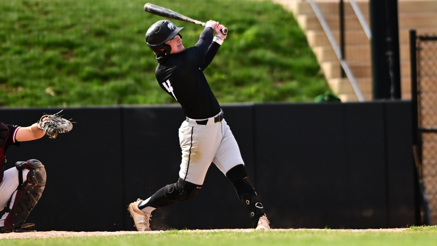 Seth Bivens looks to see where the ball is going after getting a hit.