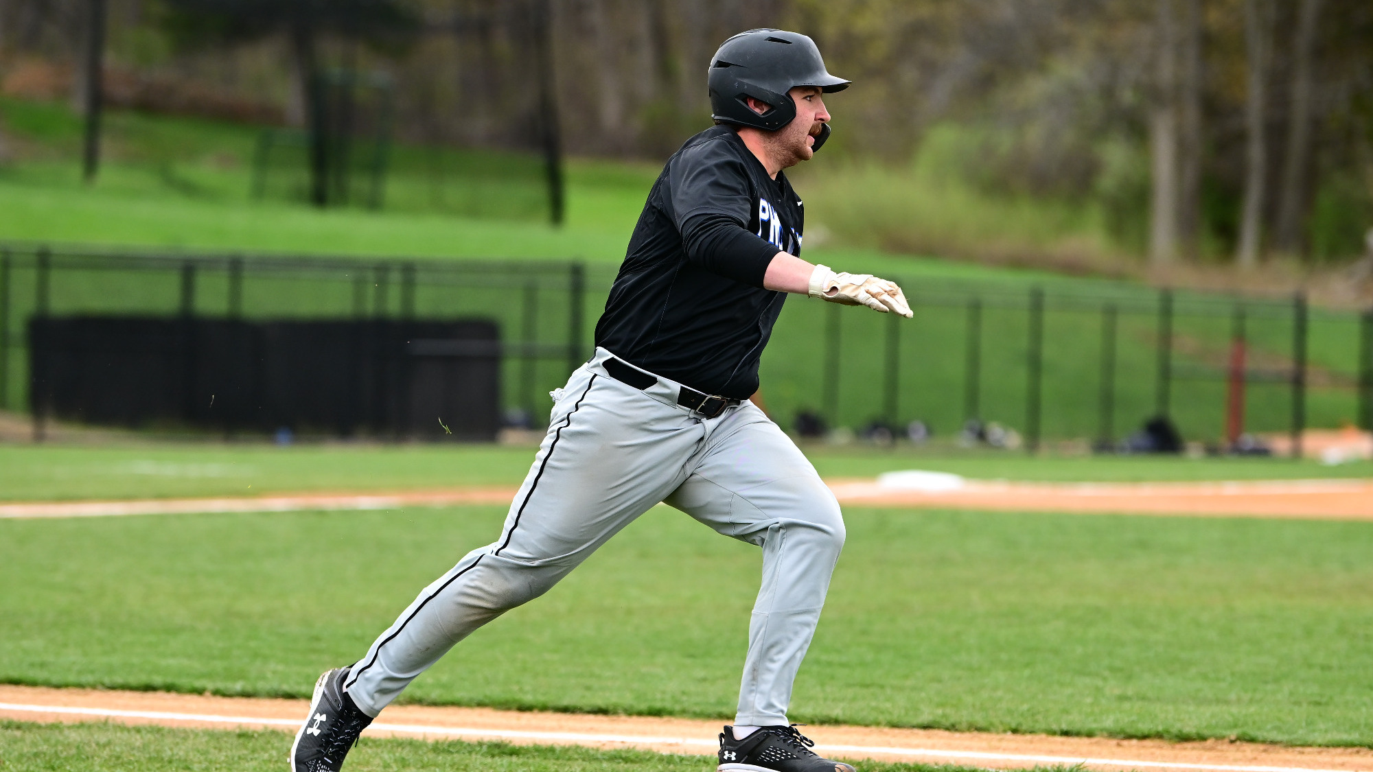 Tyler Smith runs to first after a hit
