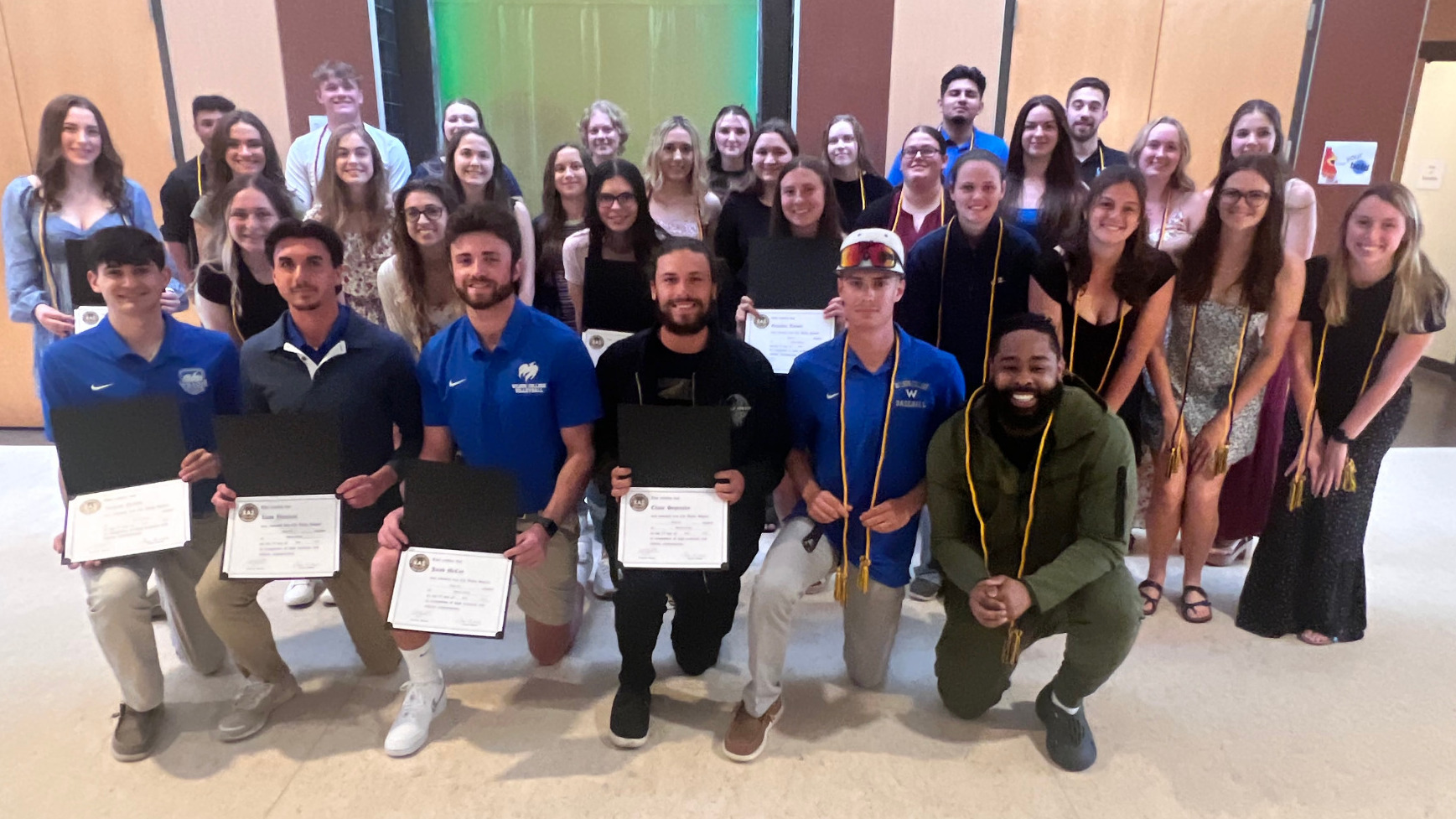 Chi Alpha Sigma Members Pose for a Picture 