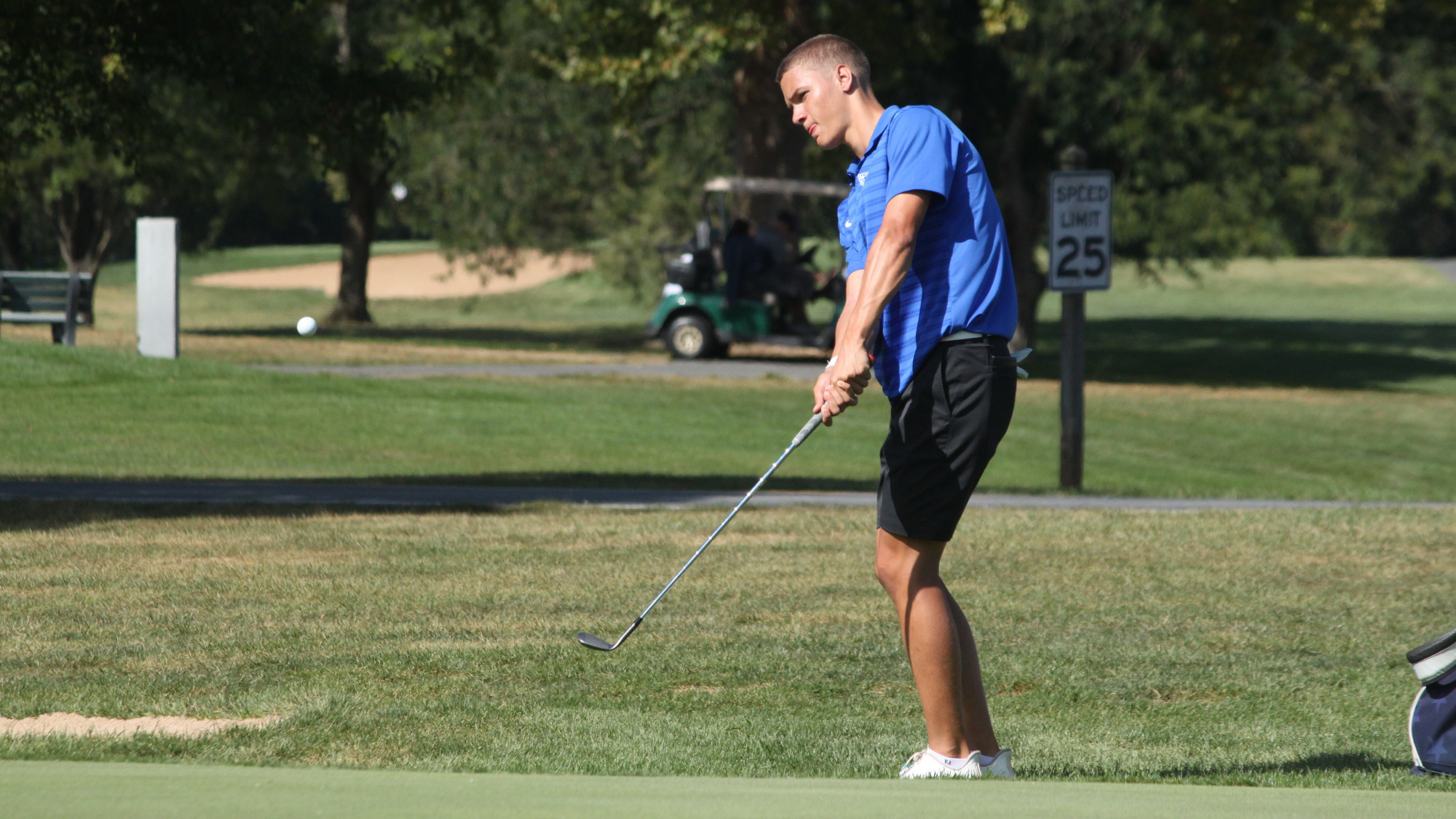 Cole Cooper hits a chip shot