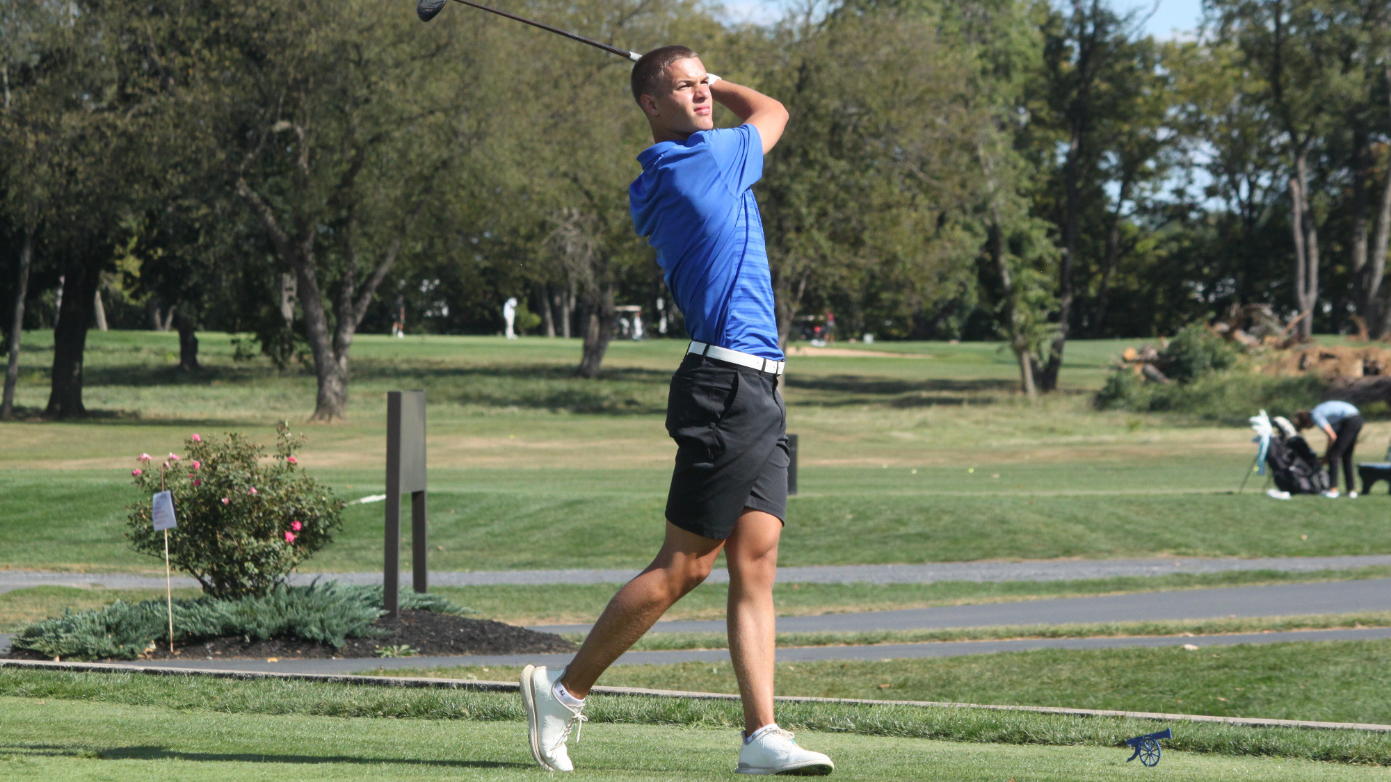 Cole Cooper watches the ball after his drive.