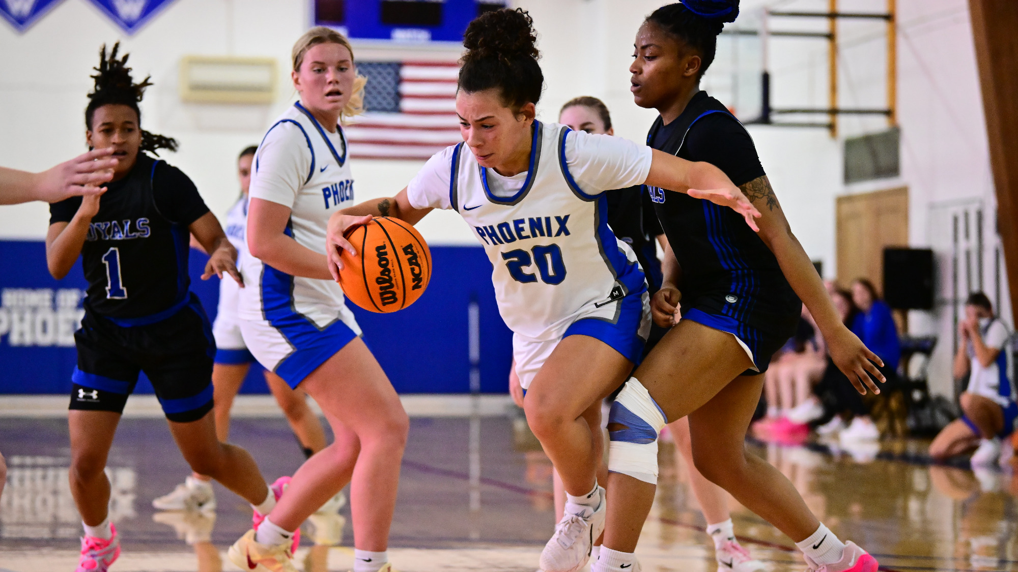 Chloe Irving dribbles through defense
