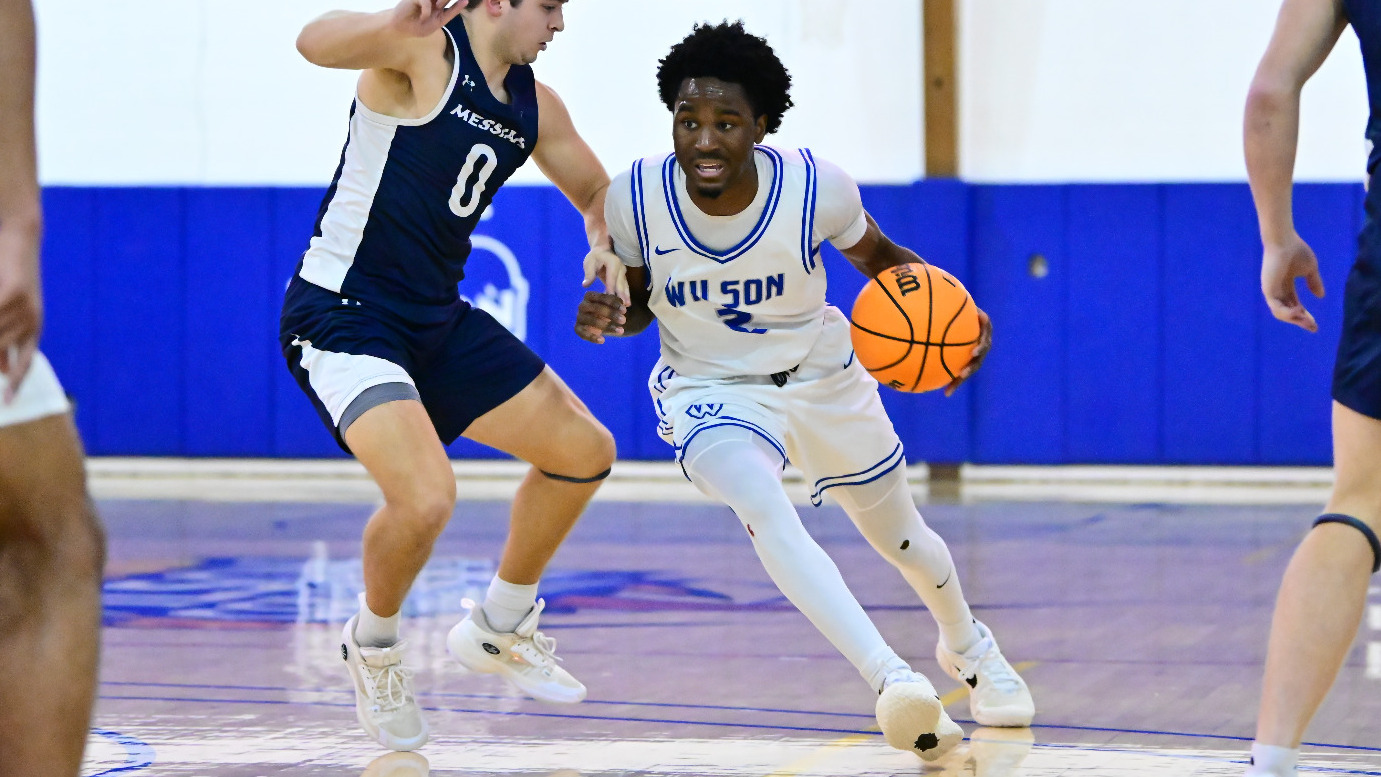 Jalen Pierce drives by a defender