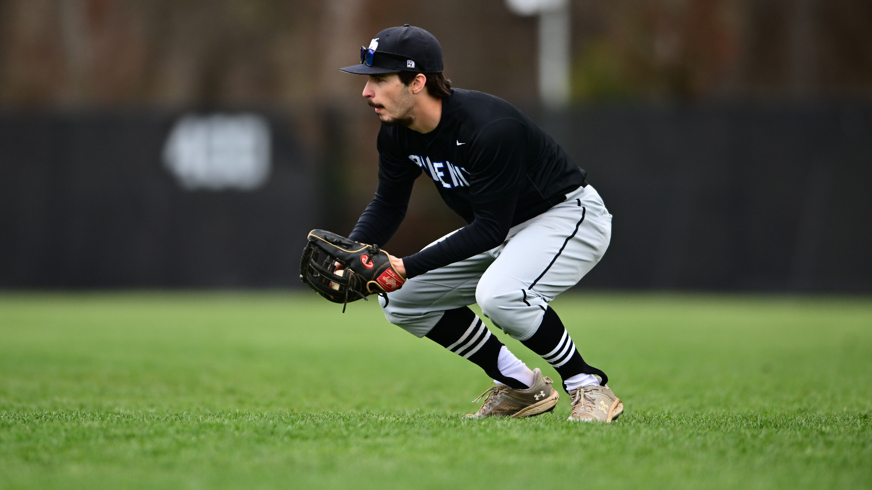 Samuel Martin scoops up a baseball