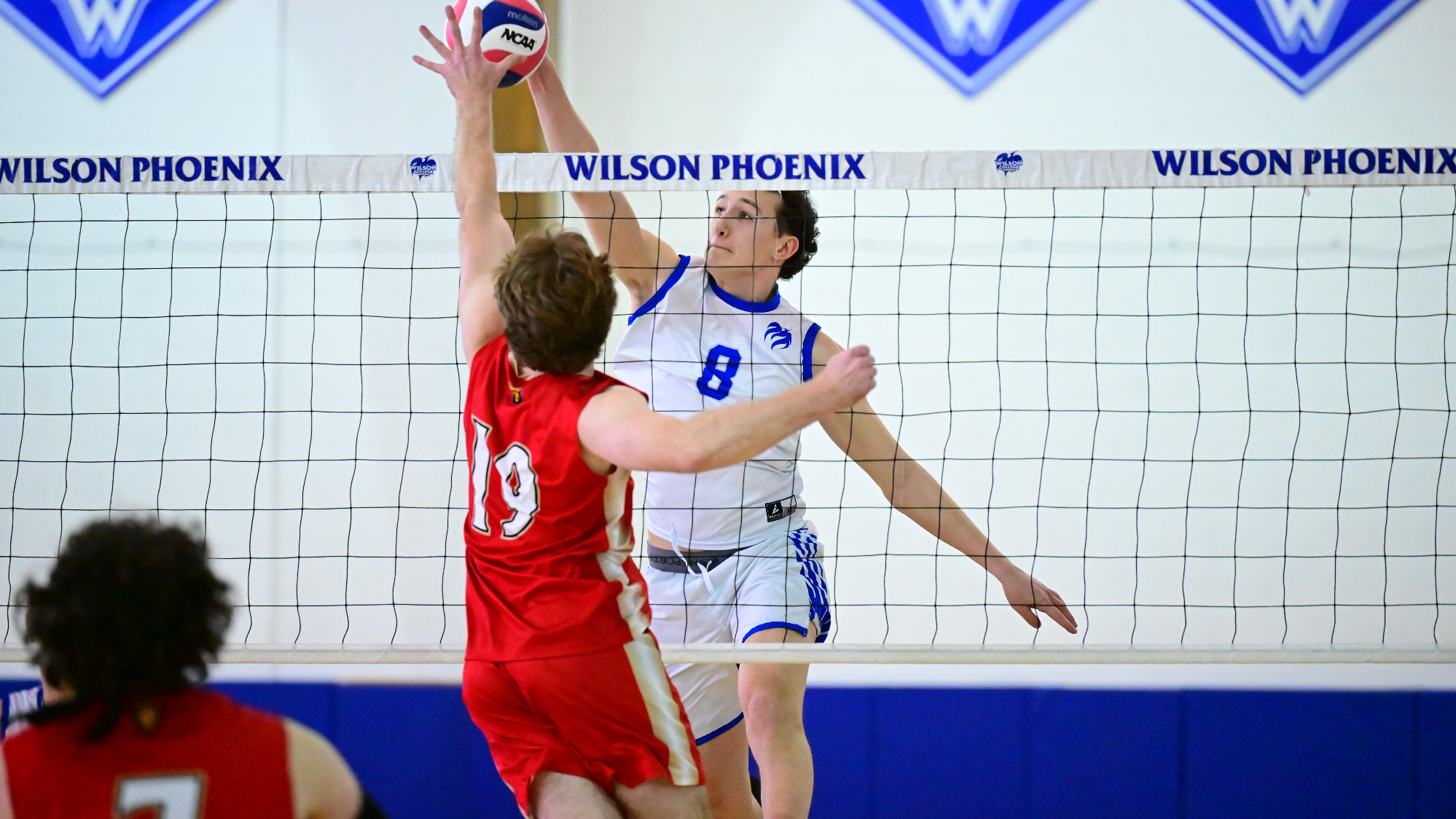 Ryan Koontz hits the ball at the net
