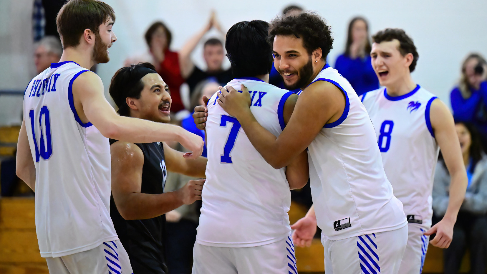 Demetrius Simmons hugs Satvik Sharma after a point