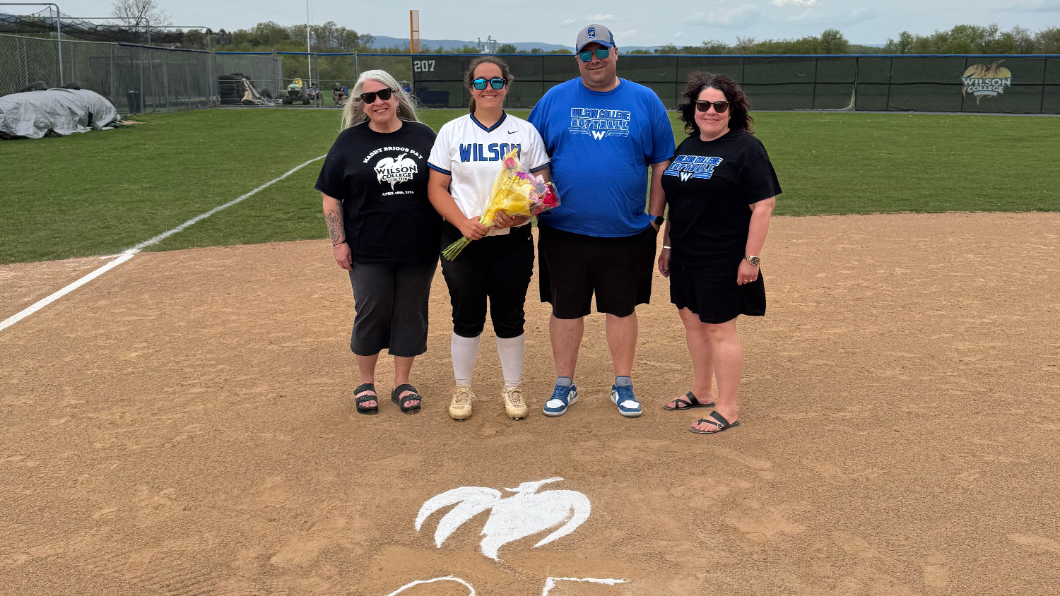 Maddy Briggs and family pose for a Senior Day Picture