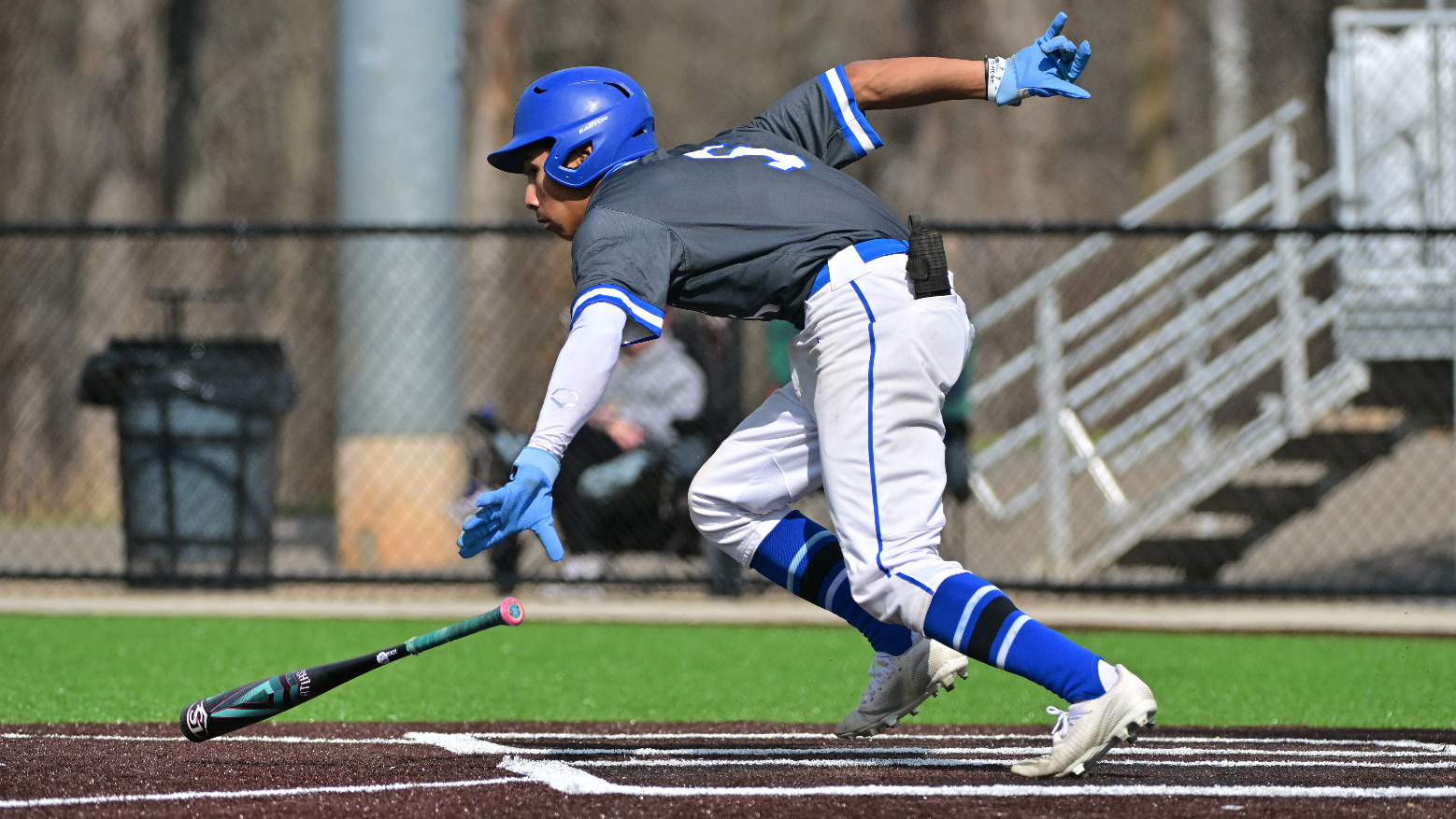 Garrett Drish drops his bat and runs to first after a hit