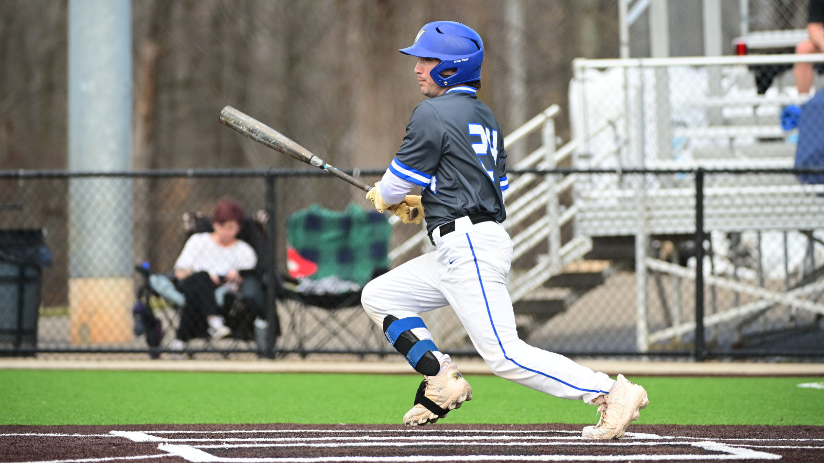 Justin Clapp runs to first after a base hit