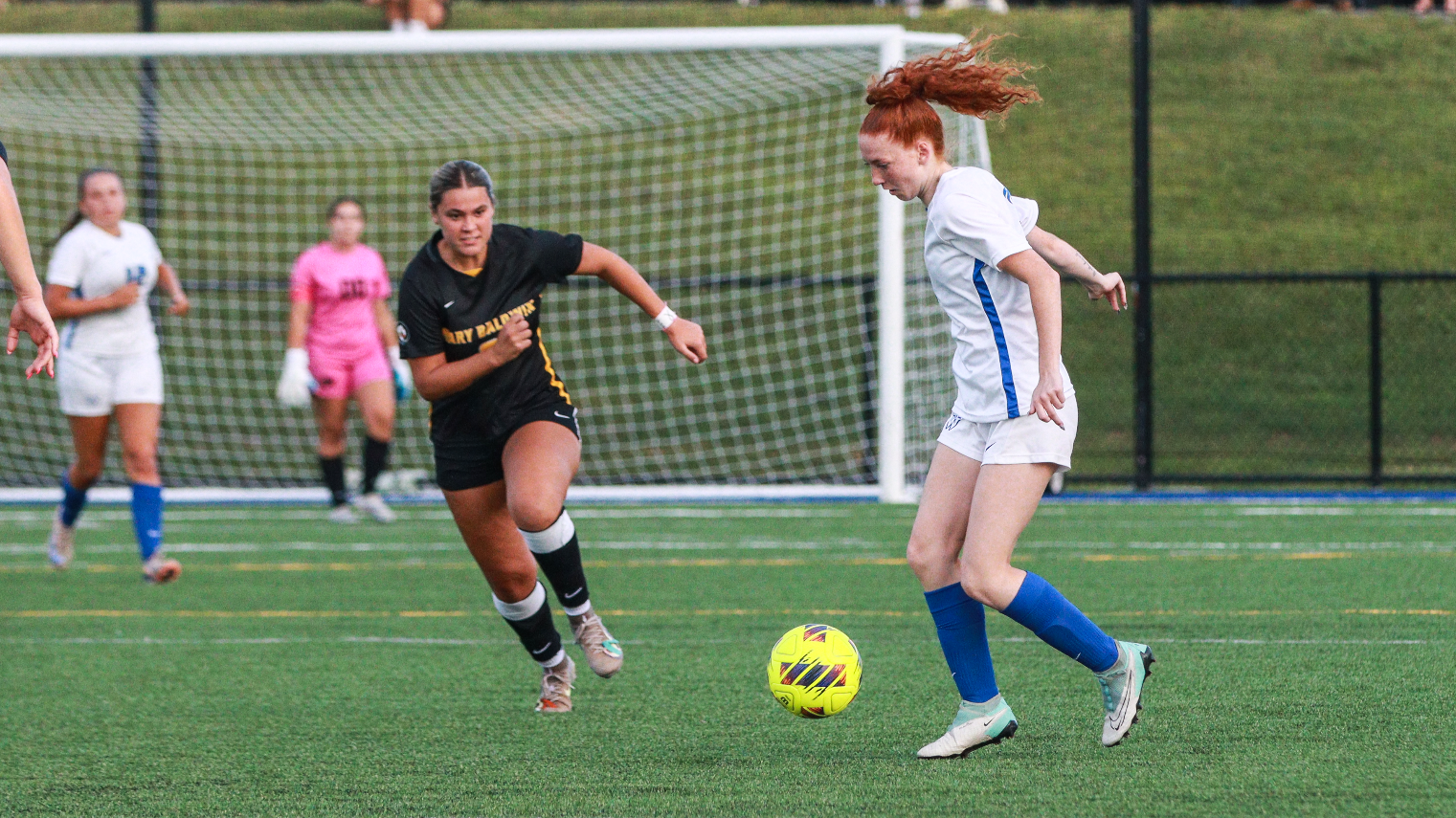 Claire Thompson controls the ball