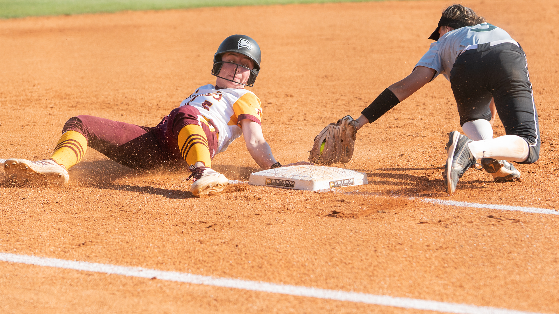 Rebecca Amos sliding into third base