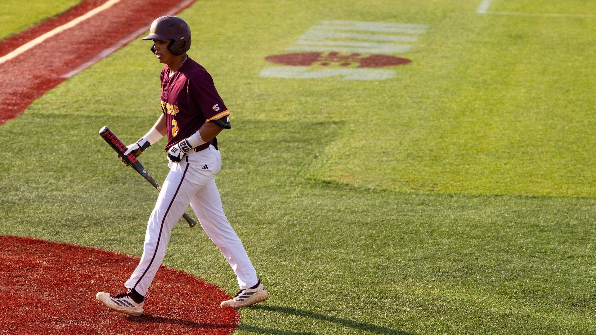 Gabe Natividad walking up to the plate to bat