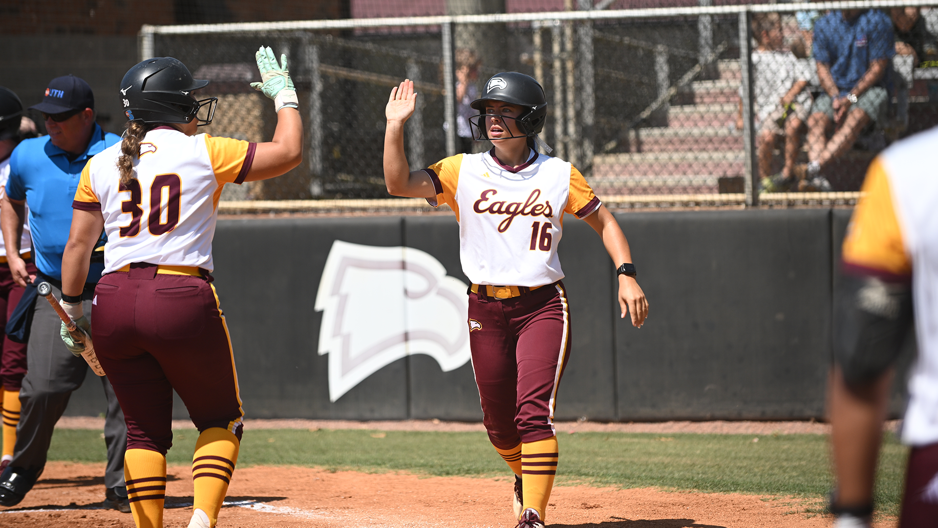 Emma Roberson Giving High Five To Darrah Nickens At Home Plate