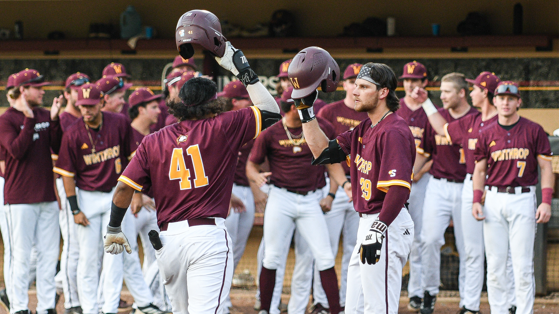 Jaylen Hernandez and Alan Benhardt celebrating a home run at home plate
