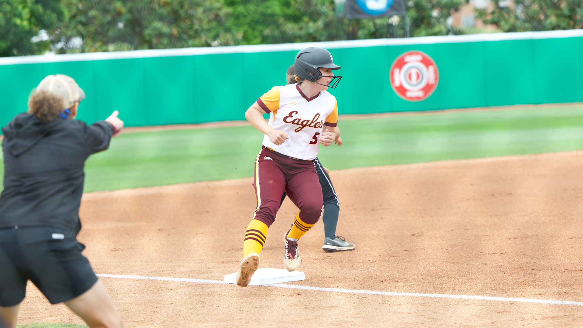 Rebecca Amos running to third base