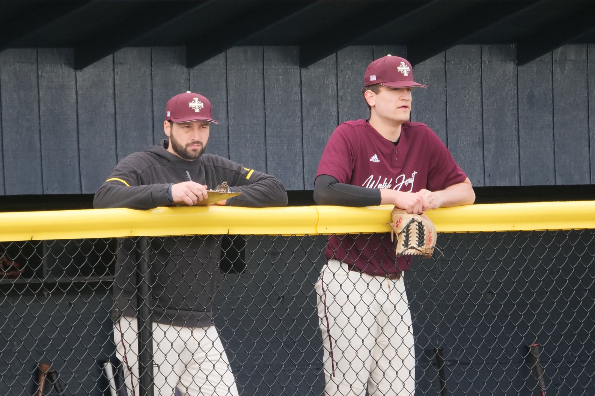 New Head Baseball Coach, Joseph Bowers Looks On during a game with pitcher Tyler Barni 