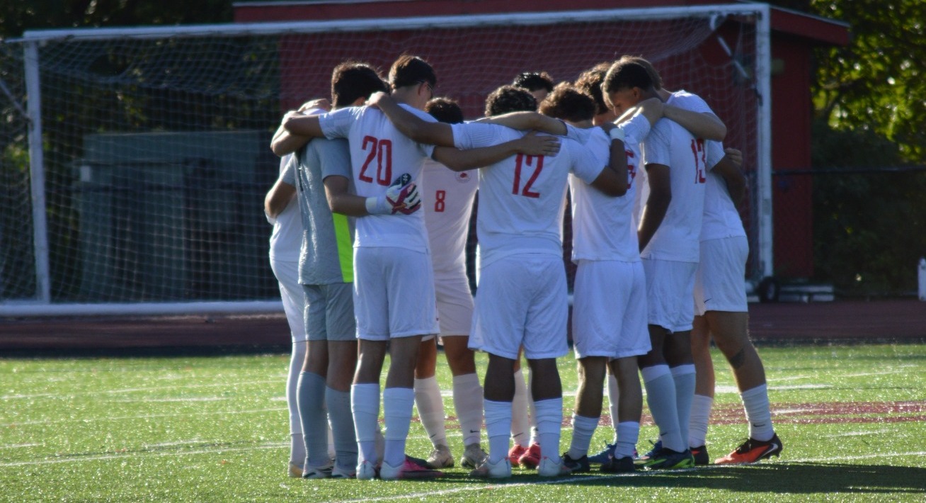 Men's Soccer Group Huddle