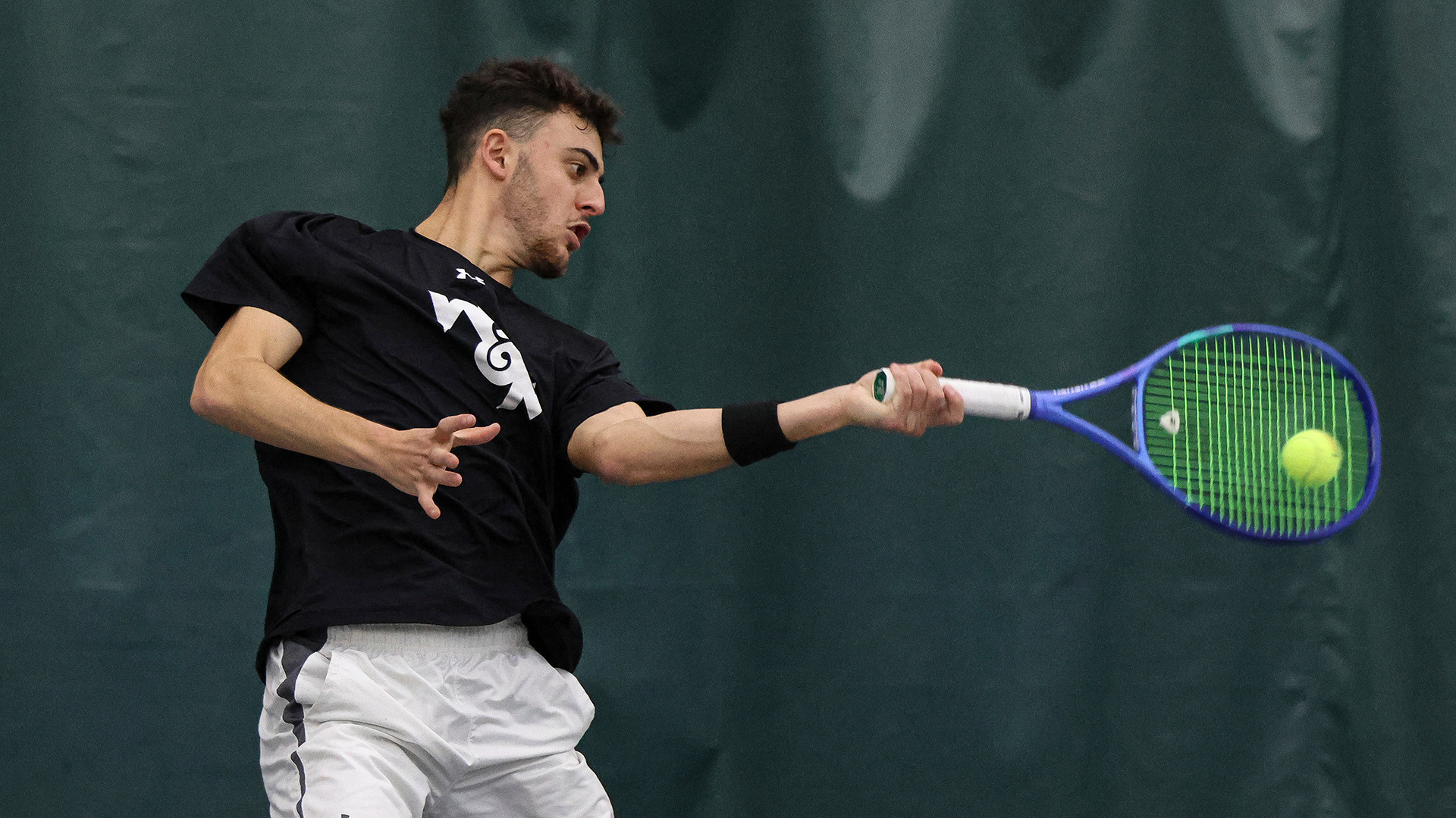 Gur Trakhtenberg hits a forehand at the McCormack-Nagelsen Tennis Center against Norfolk State. 