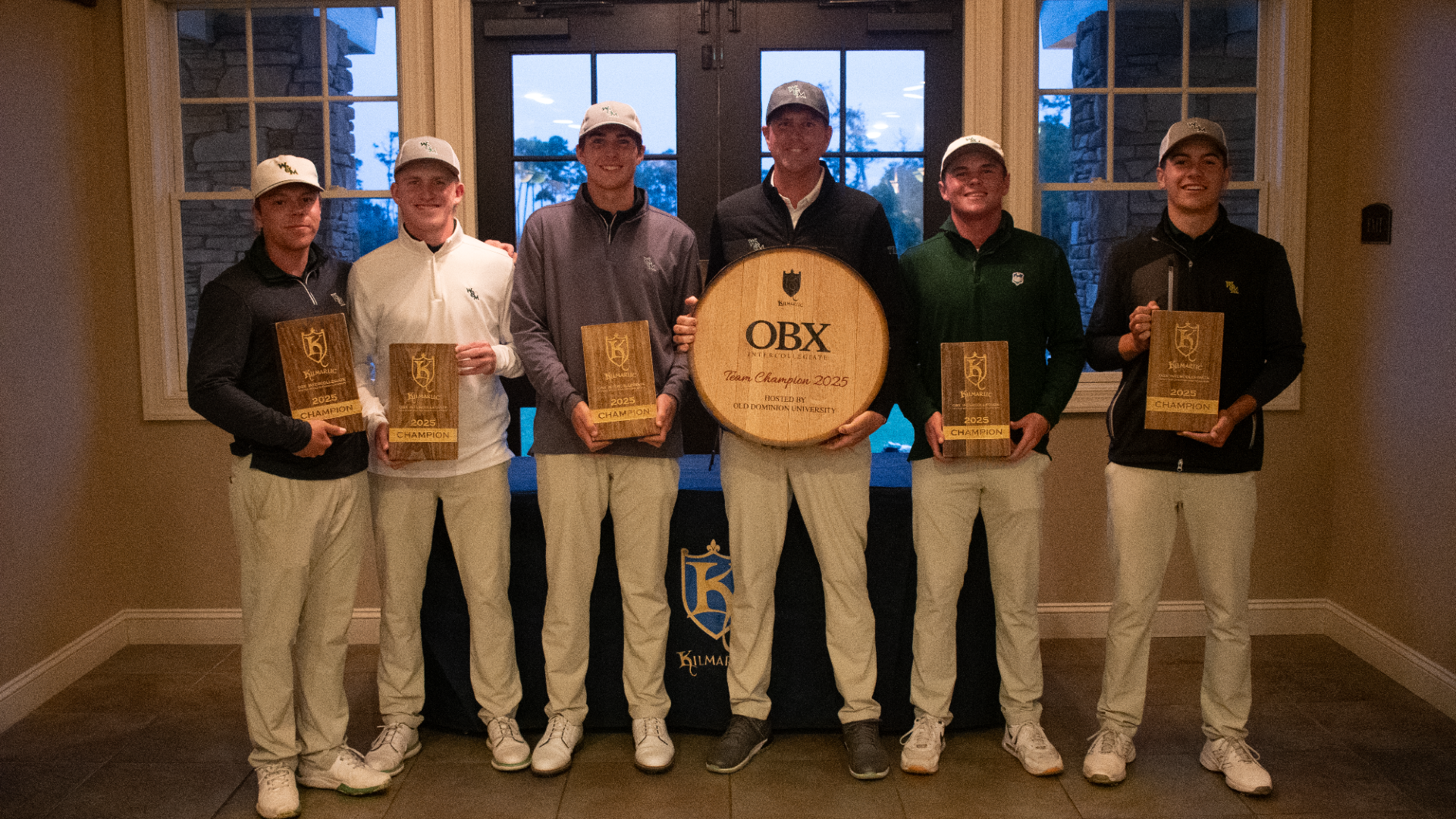 Men's Golf poses with awards at the ODU/OBX Intercollegiate