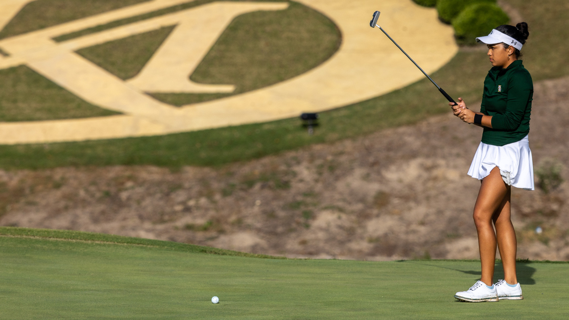 Faith Garcia lines up a putt at Kingsmill