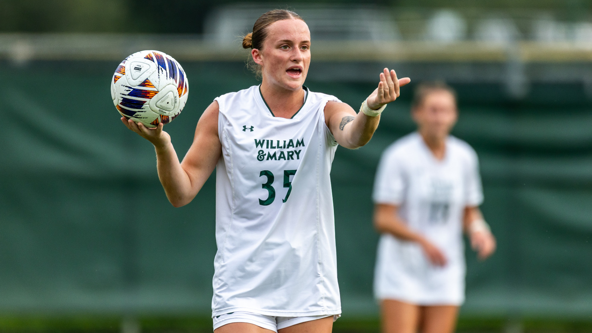 Ava Schultz directs traffic before throwing the ball
