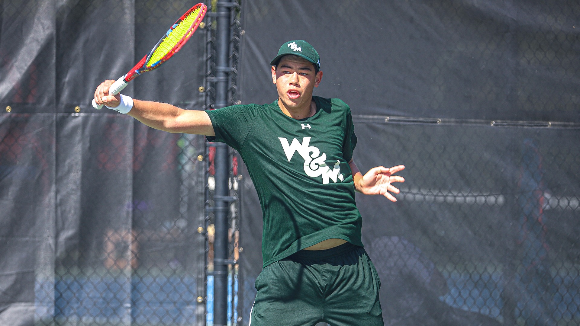 Dylan Chou follows through hitting a backhand at the River City Open. 