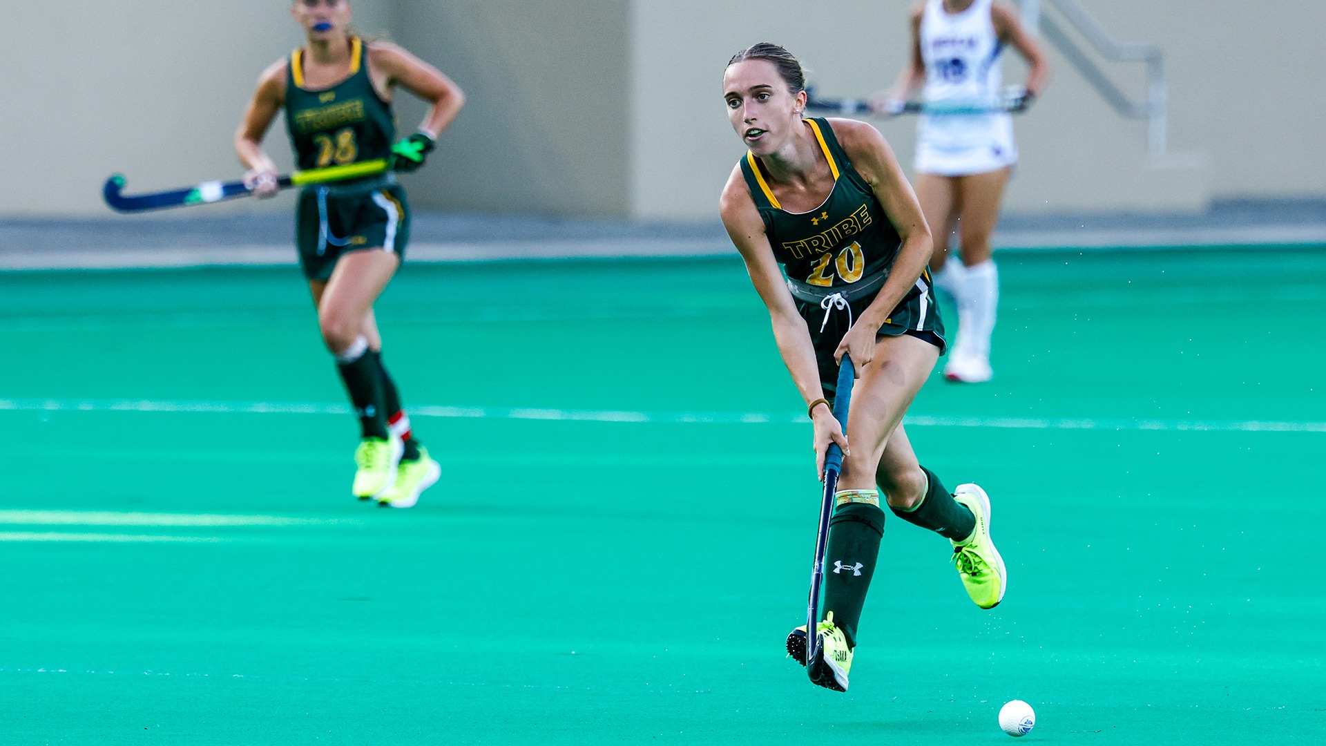 Natasha Browning passes the ball up field against American. 
