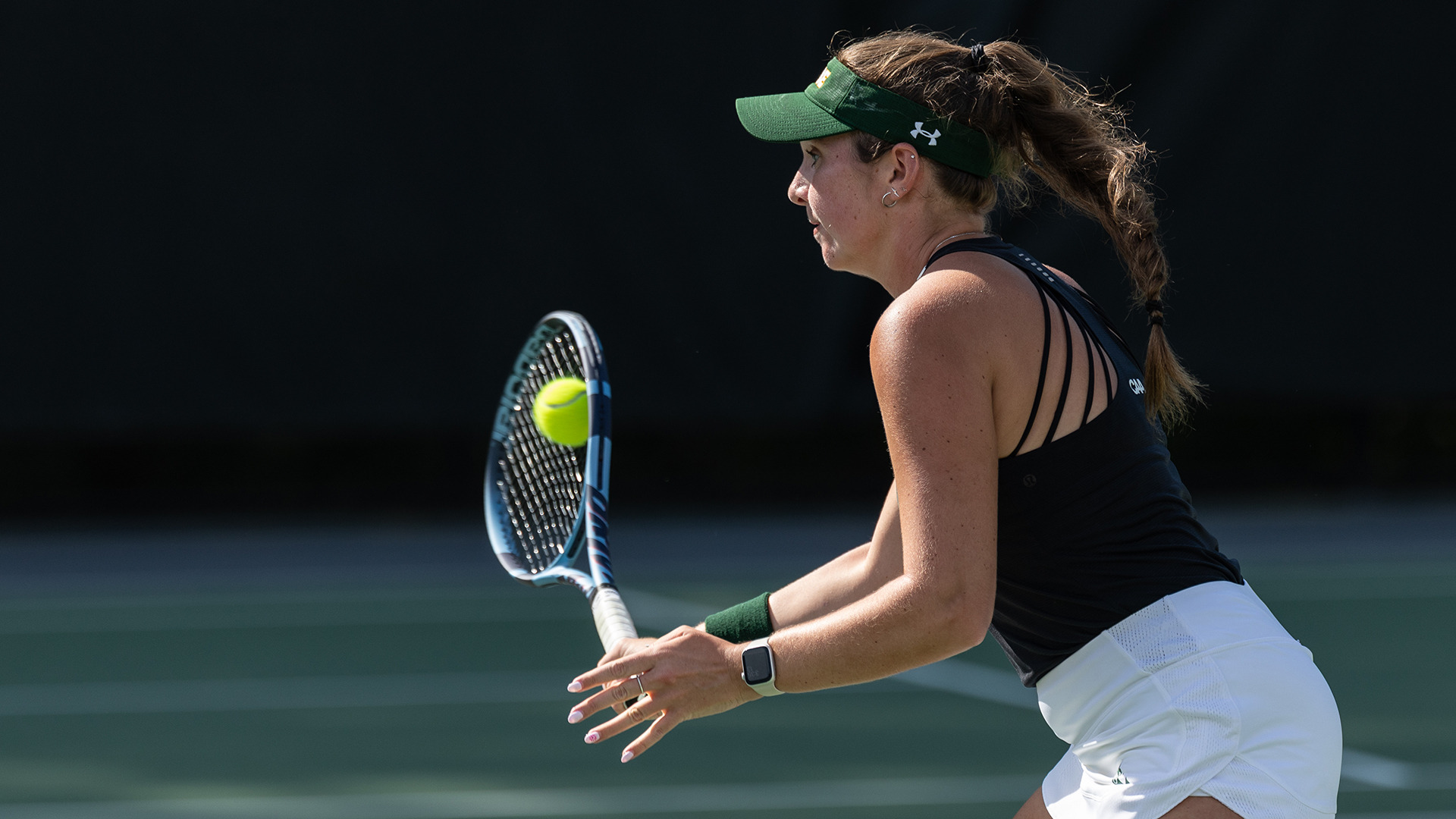 Parker Debnam hits a volley at the net at the Mackey Tennis Center during the Tribe Invitational