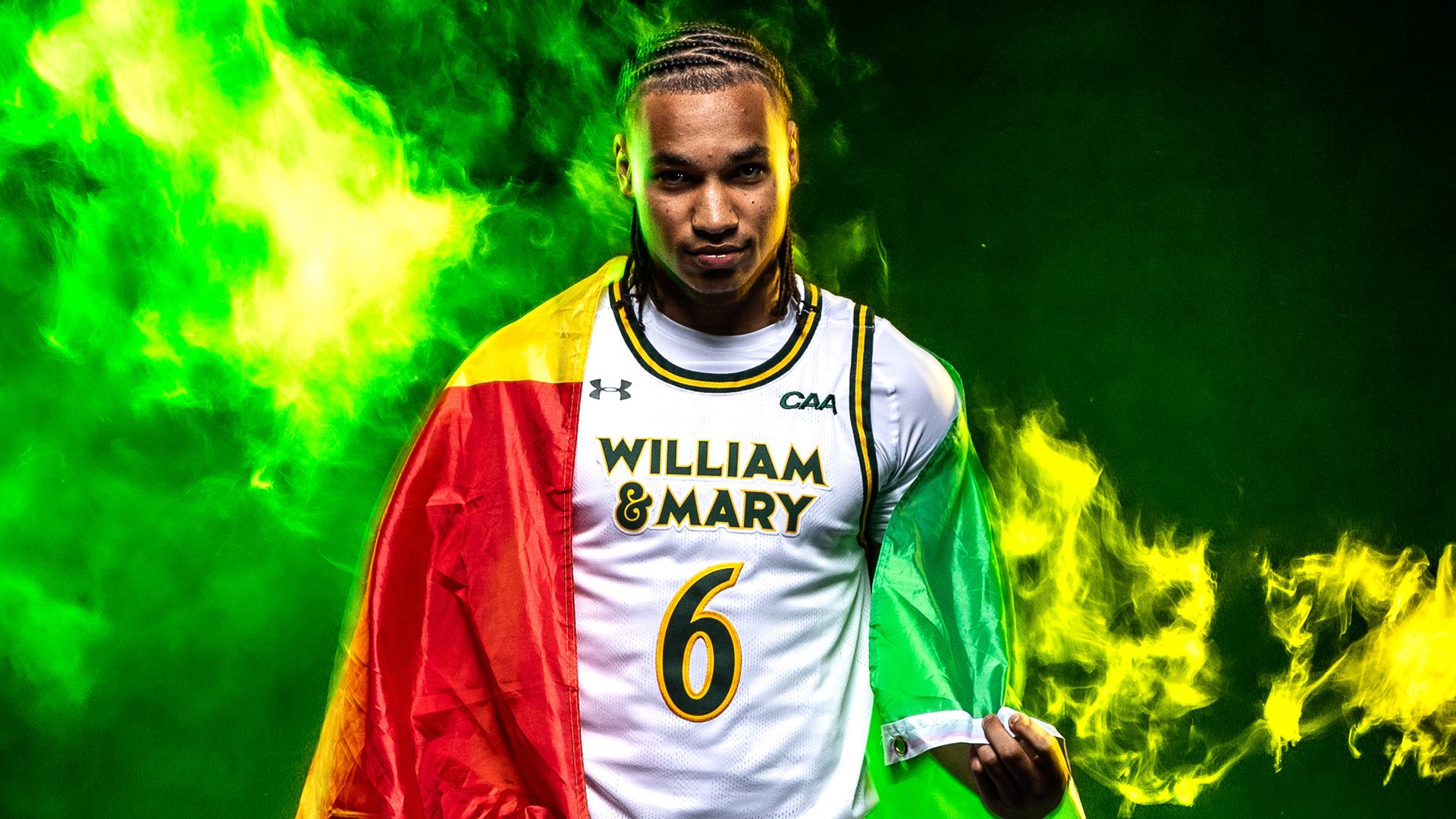 Colin Lamine Ndaw looks at the camera with a Senegalese flag on his back with a neon smoke in the background. 