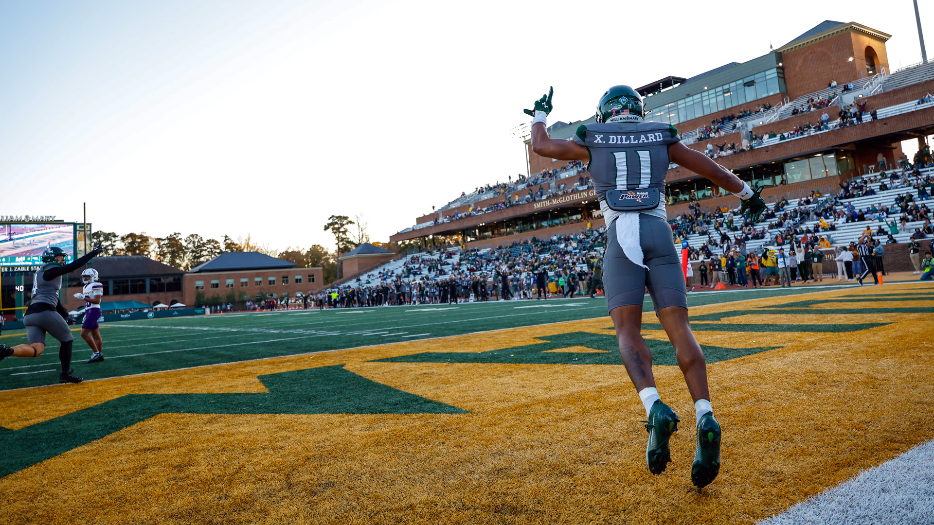 Xavier Dillard points towards the sky as he celebrates in the end zone at Zable Stadium