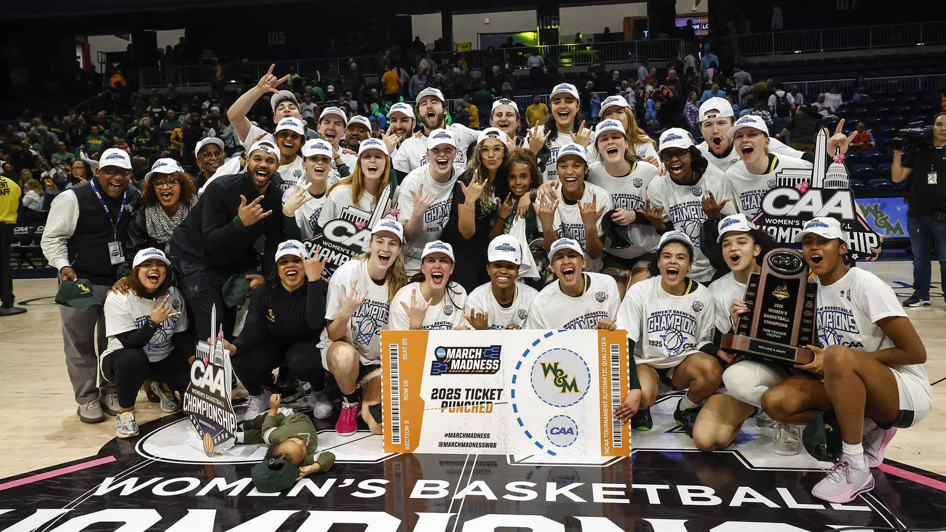 The Tribe poses for a team photos with the championship trophy and sign after winning the 2025 CAA title.