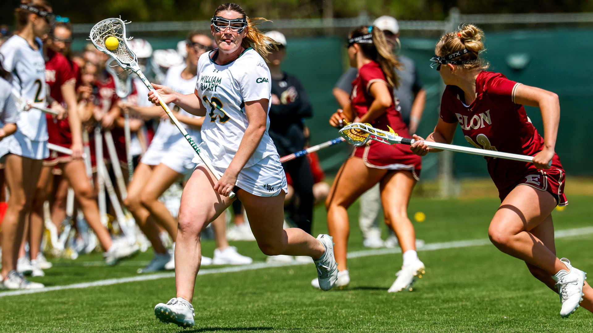 Molly Delaney runs down the field with the ball versus Elon at Martin Family Stadium