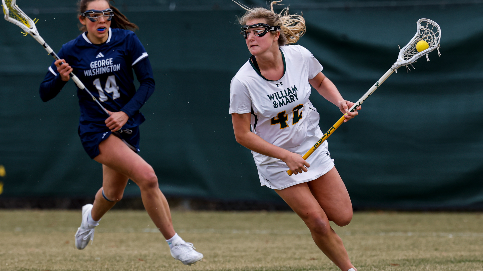 Paige Gilbert runs down the field with the ball versus George Washington
