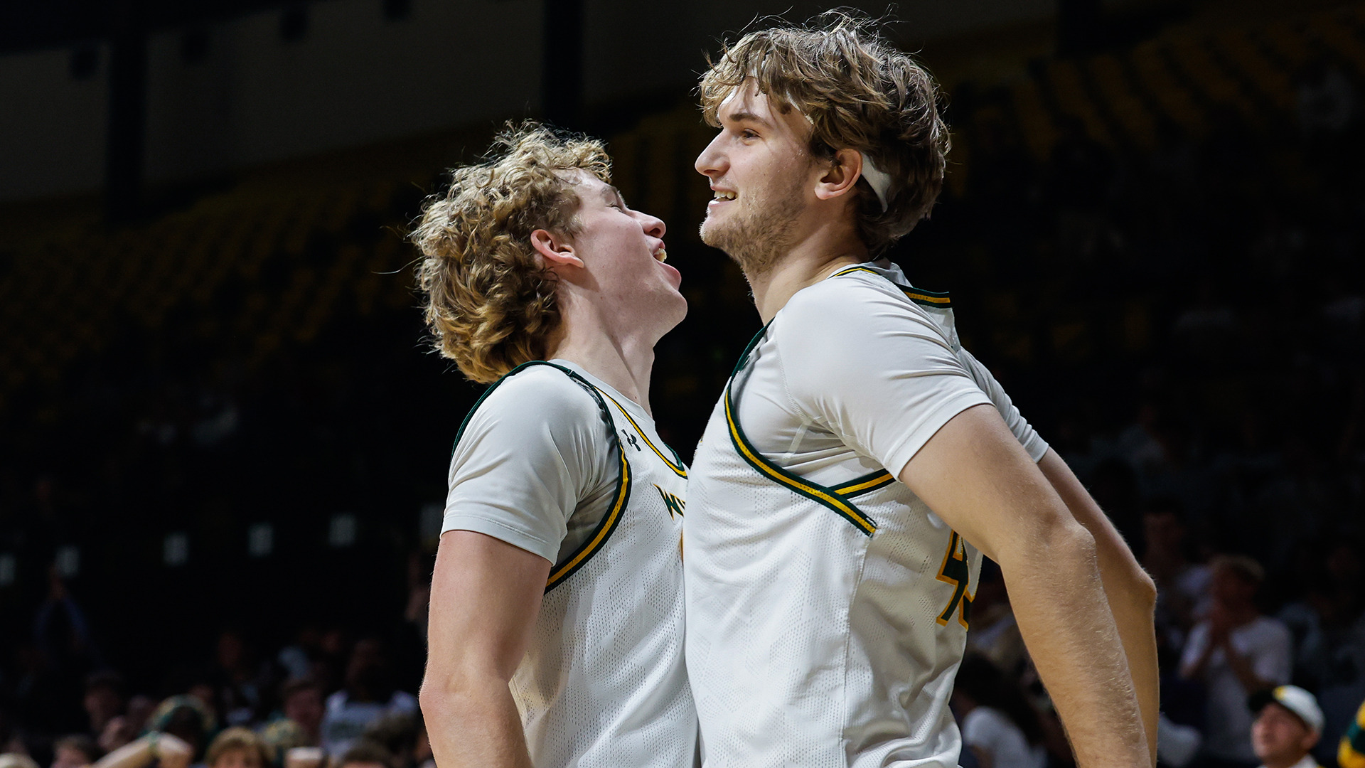 Reese Miller and Finn Lally chest bump after Lally's made lay-up in the first half vs. UNCW on Jan. 22, 2026. 